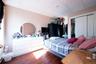 Bedroom with a drop ceiling, a closet, and dark hardwood / wood-style floors