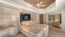 1st Floor Primary suite seamlessly opens to an adjoining lounging area, creating a private retreat