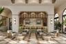 The Owner’s Lounge at Mira Mar features a beautifully designed gathering space with an elegant bar area, offering residents a sophisticated setting to