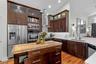 Spacious kitchen featuring built-in appliances and abundant cabinetry.