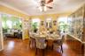 Dining space with plenty of natural light, a ceiling fan, and hardwood / wood-style floors