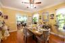 Dining room with hardwood / wood-style floors and ceiling fan