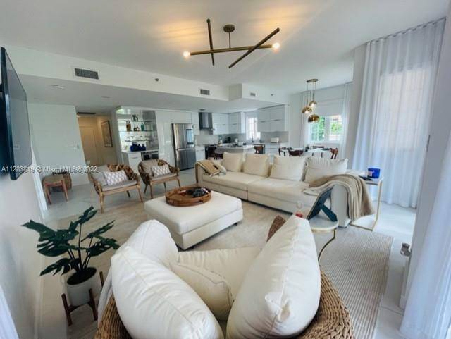 JUST REMODELED UNIT AT FISHER ISLAND UNIQUE LARGE MODEL IN THE BUILDING, 2BED 2 BATHS FIRST FLOOR WITH AN OPEN CONCEPT HUGE BALCONY THAT GOES AROUND THE WHOLE APARTMENT WITH ...
