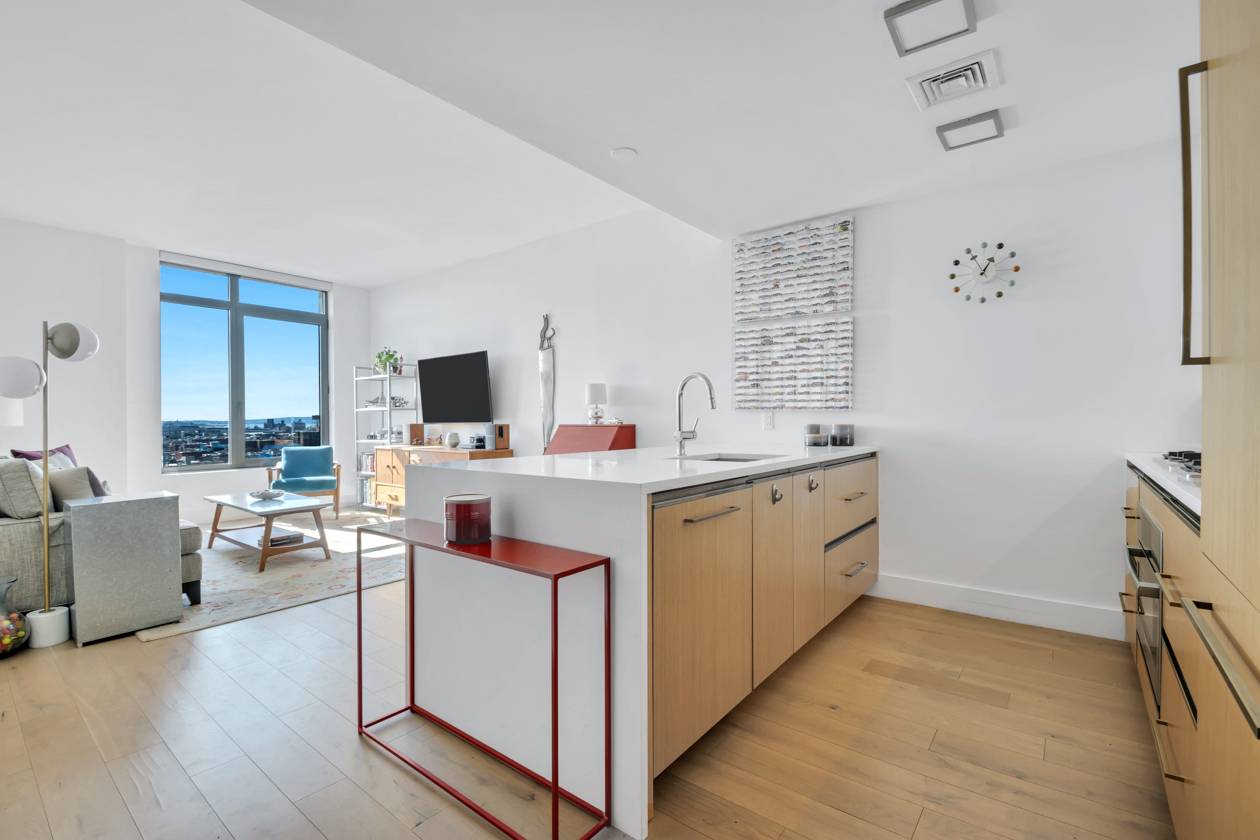 Perched on the 14th floor of The Nevins sits this well appointed home with sweeping river and Brooklyn views.