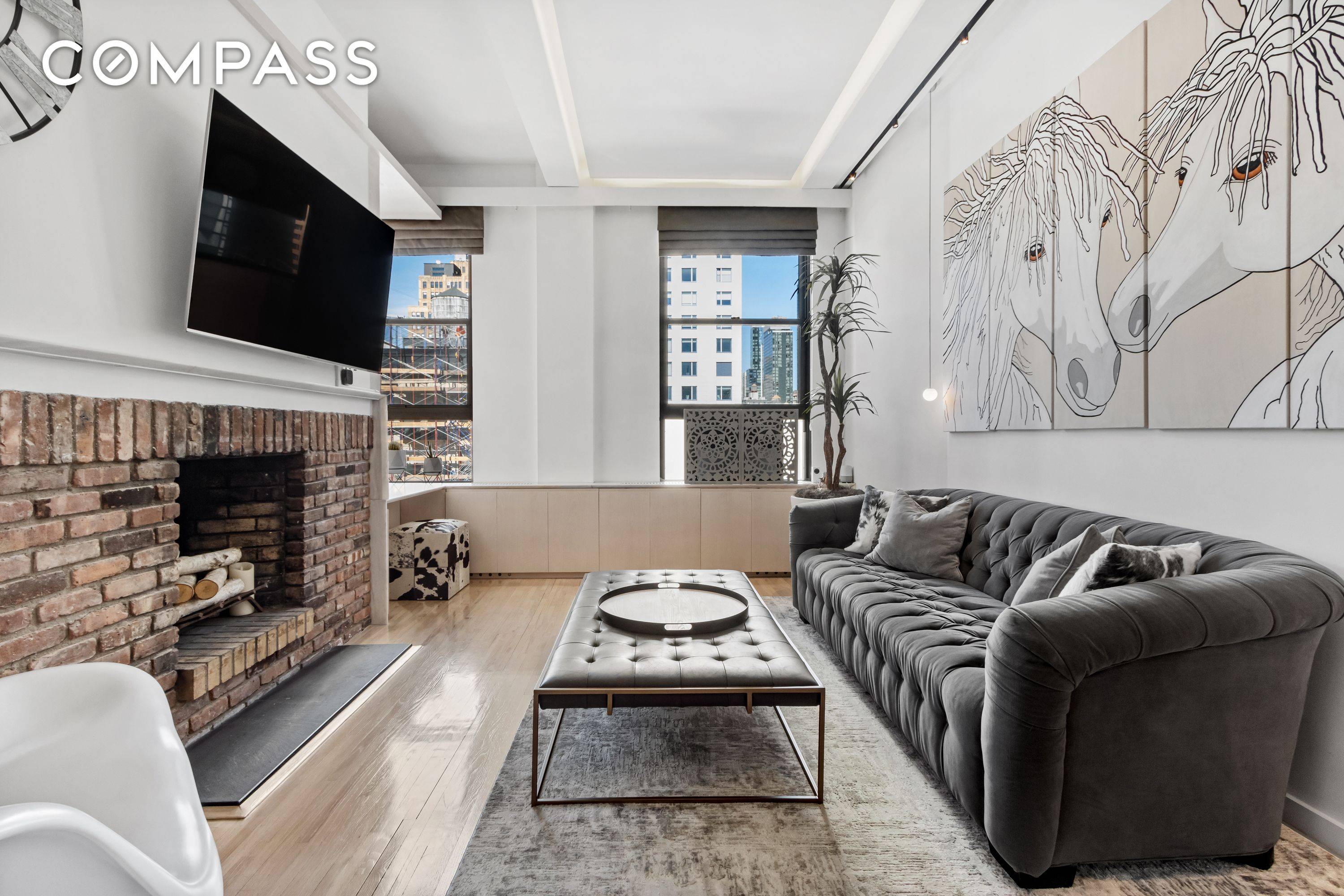 Penthouse one bedroom loft with oversized windows and soaring 11 high ceilings.