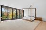 Bedroom featuring floor to ceiling windows, light wood-style flooring, access to exterior, and recessed lighting