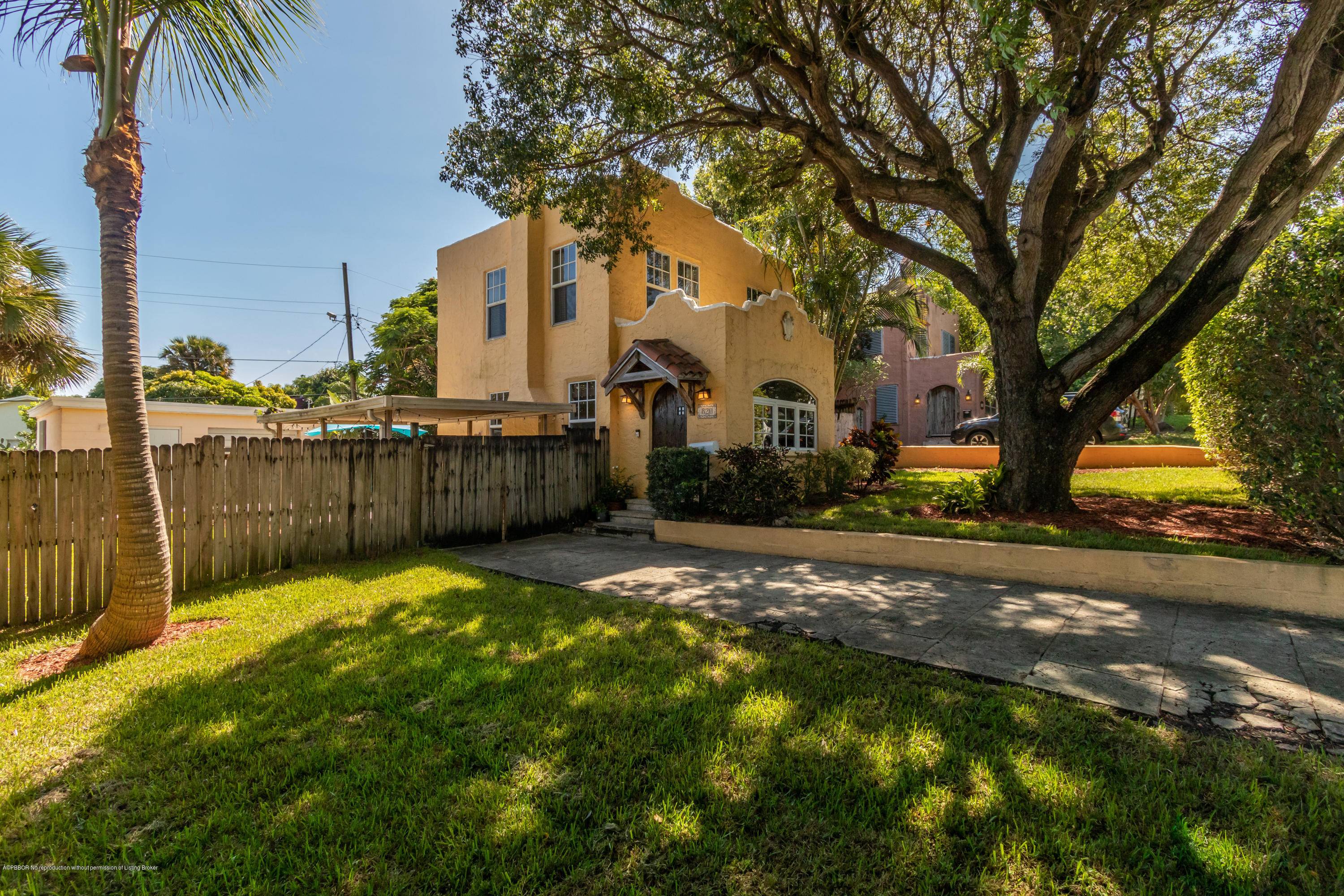 This completely renovated, two story Spanish style, three bedroom historic home sits on an extra large lot with a double garage near downtown West Palm Beach.
