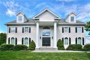 This fantastic modern colonial is set within the Compo Commons neighborhood of Westport, sitting on a level half acre lot with a beautiful lawn.