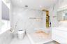 Ensuite Modern bathroom featuring large-format wall and floor tiling with subtle veining
