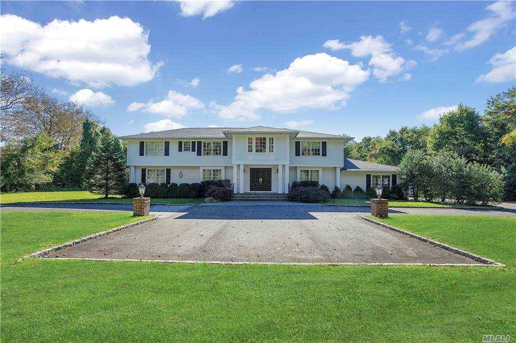 OLD WESTBURY. Captivating Custom Built Center Hall Colonial ; Located On Over 2 Private Acres In The Village of Old Westbury.