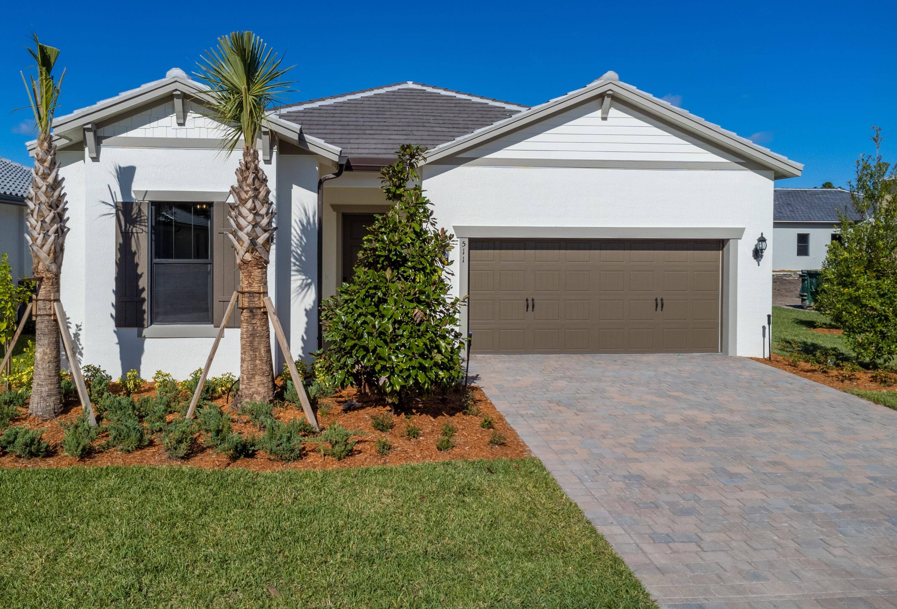 Gorgeous, move in ready luxury home built in 2022 in Prestigious Veranda Gardens, the neighbors just North of Palm City.