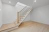 Full basement with high ceilings and outside entrance, offering excellent potential for future finished space or storage.