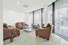 Living room featuring expansive windows, cooling unit, recessed lighting, and light tile patterned floors