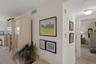 Hallway to bedrooms & bathrooms is adjacent to dining area