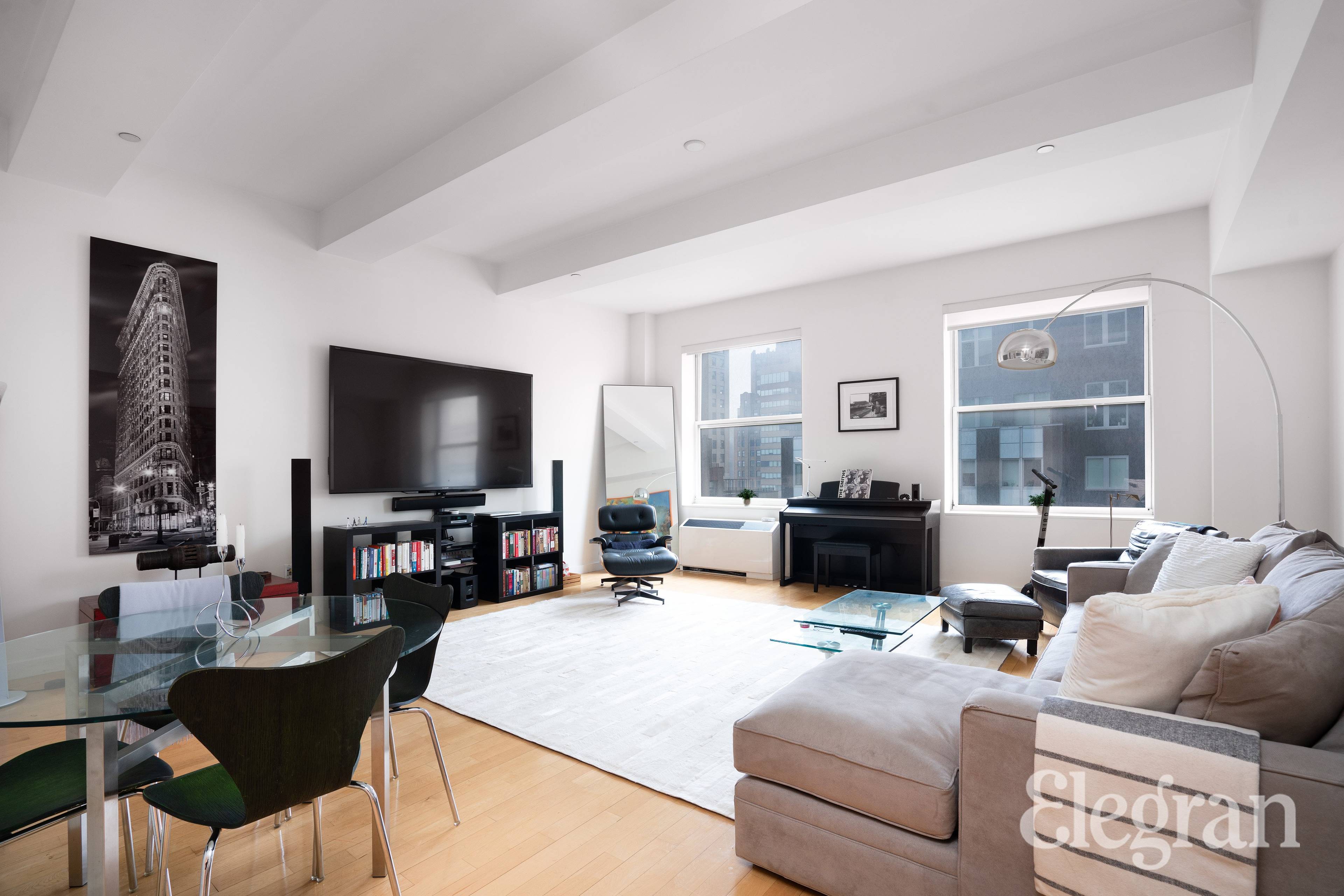 Soaring 11 ft. ceilings compliment the large living room of this beautiful Financial District loft.