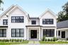 View of front of house with french doors, a standing seam roof, roof with shingles, metal roof, and board and batten siding