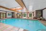 Indoor pool featuring a skylight