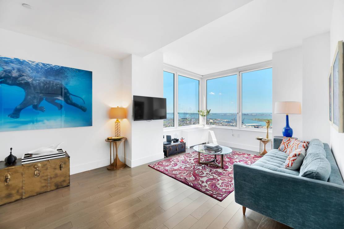 This two bedroom, two bath home boasts triple exposure with panoramic views of nearly every NYC landmark Midtown Manhattan Skyline and East River to the north, One World Trade Center, ...