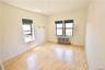 Unfurnished room with radiator and wood finished floors