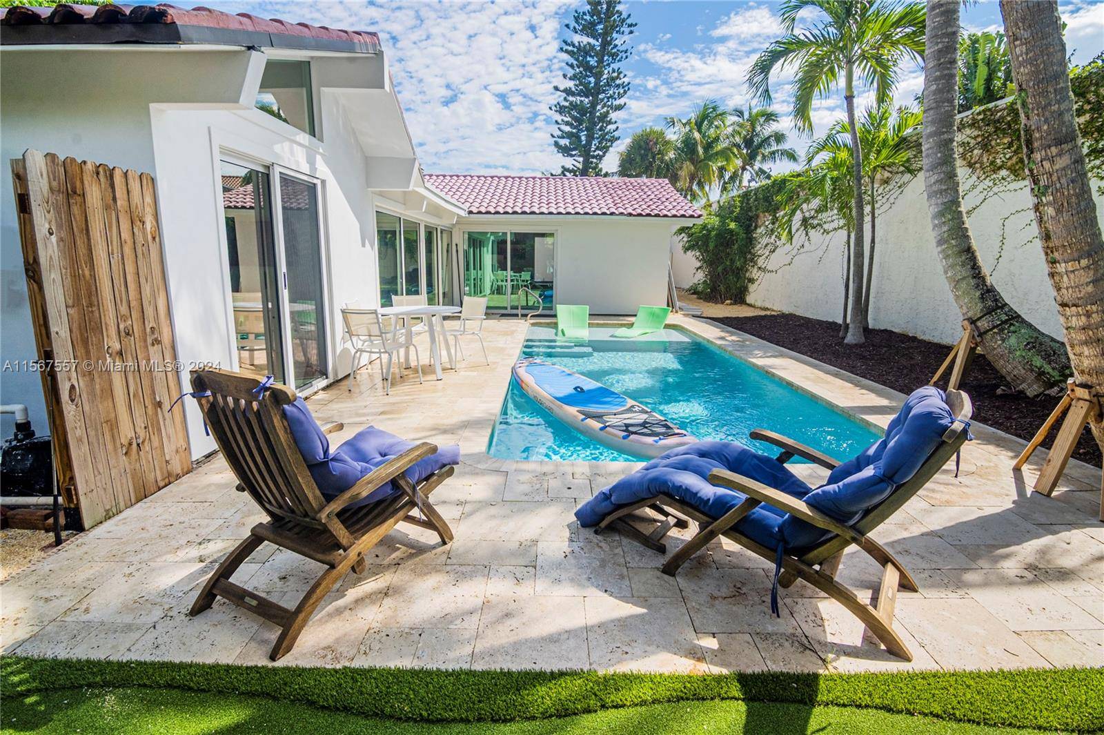 Walk to the beach from this private pool spa home in a gated Jupiter beach community.