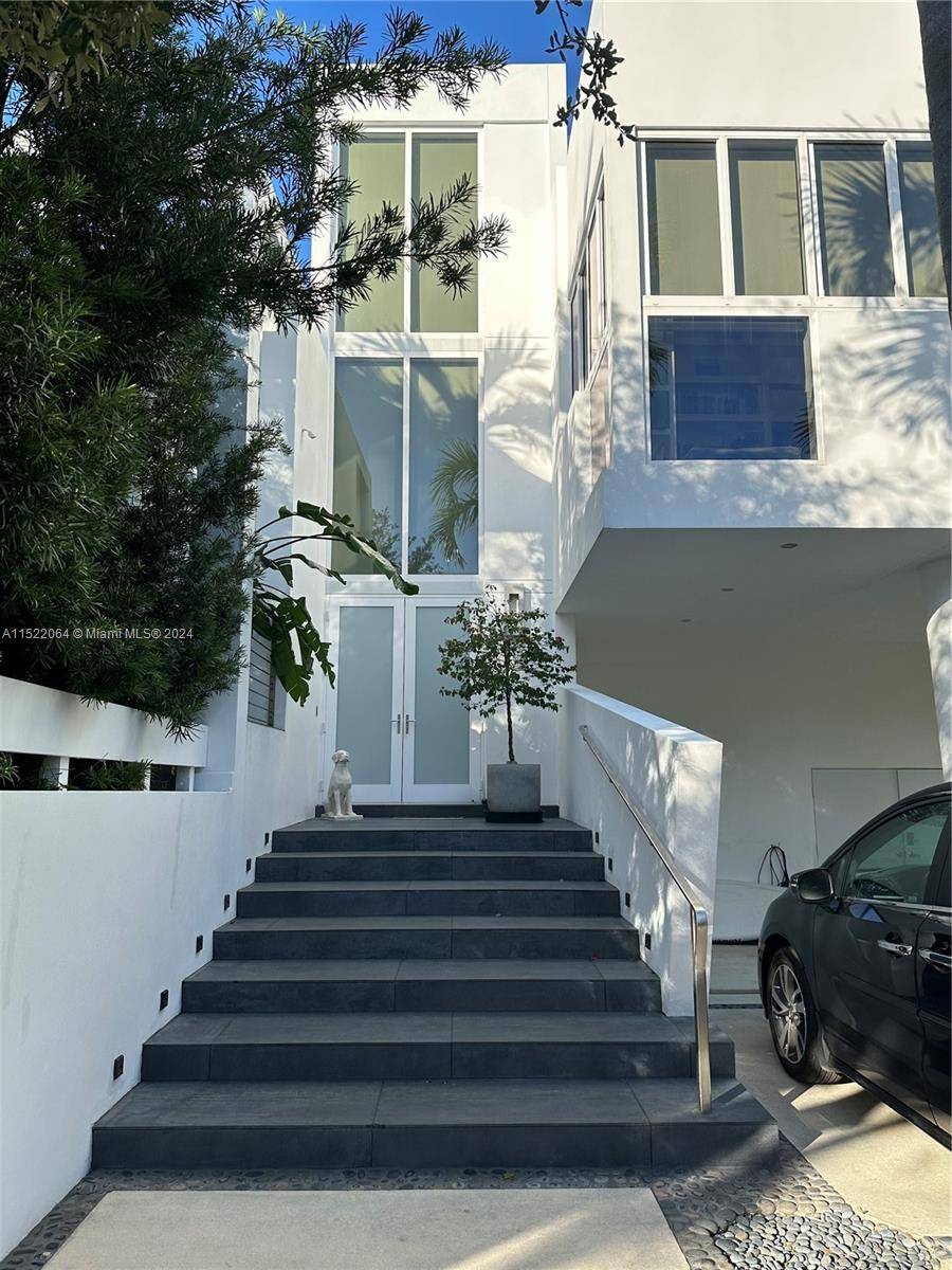 RARE OPPORTUNITY TO PURCHASE THIS CLASSICALLY MODERN CUSTOM HOME DESIGNED BY RENOWNED MIAMI ARCHITECT ALLAN SHULMAN.