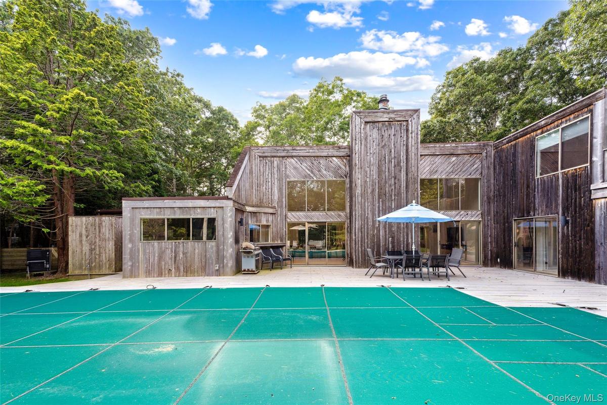 View of swimming pool featuring a grill