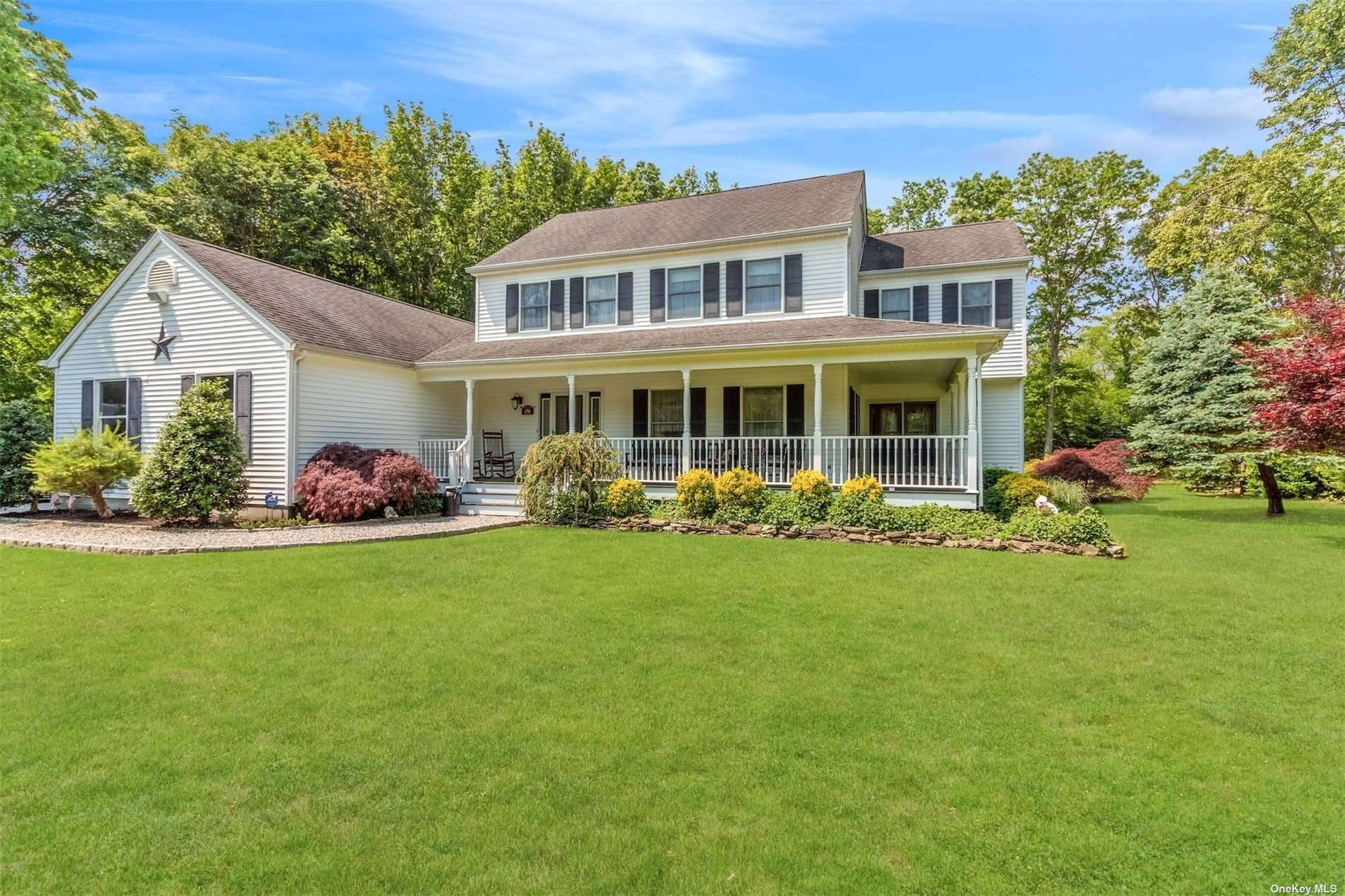 Tucked away in Golden View Estates rests this beautiful colonial classic on a sprawling shy acre of land.