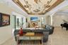 Seamless indoor-outdoor living with panoramic water views beyond.