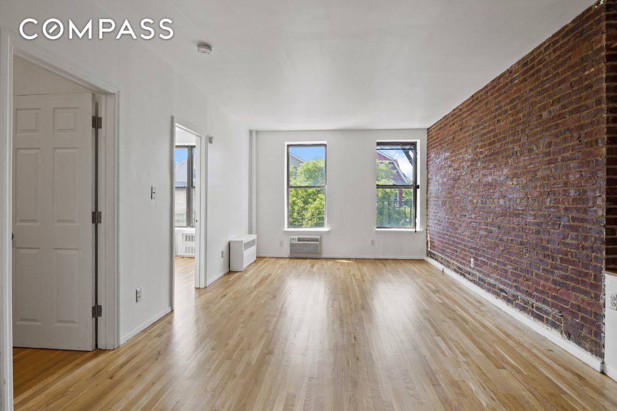 Beautiful Kensington two bedroom filled with sunlight and gorgeous exposed brick !
