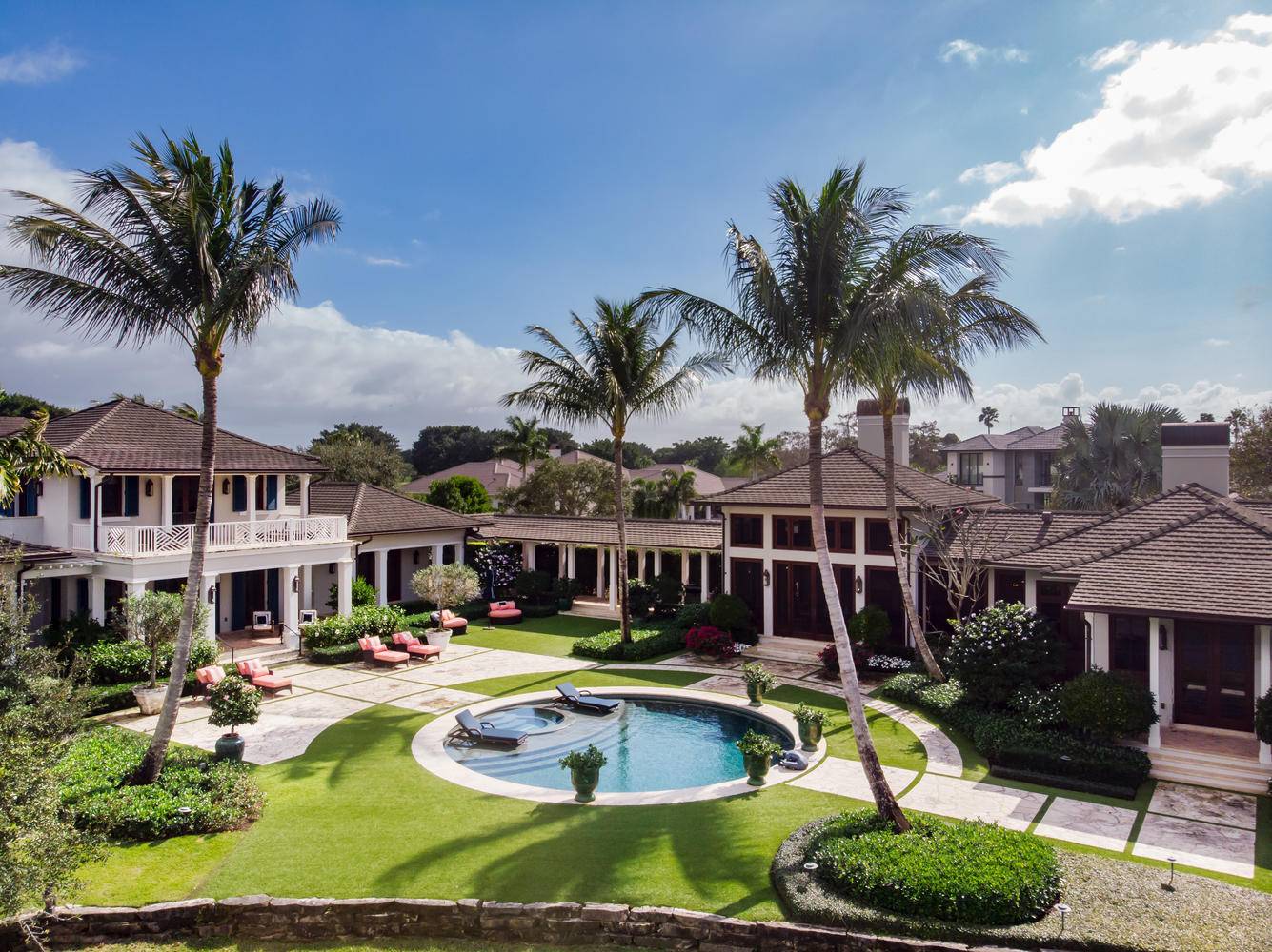 Located in the exclusive Cypress Island subdivision of Palm Beach Polo rests this breathe taking British West Indies style estate home.