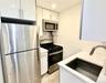 Kitchen featuring stainless steel appliances, white cabinets, tasteful backsplash, recessed lighting, and modern cabinets