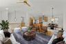 Virtually staged view of the living room, dining room and kitchen.