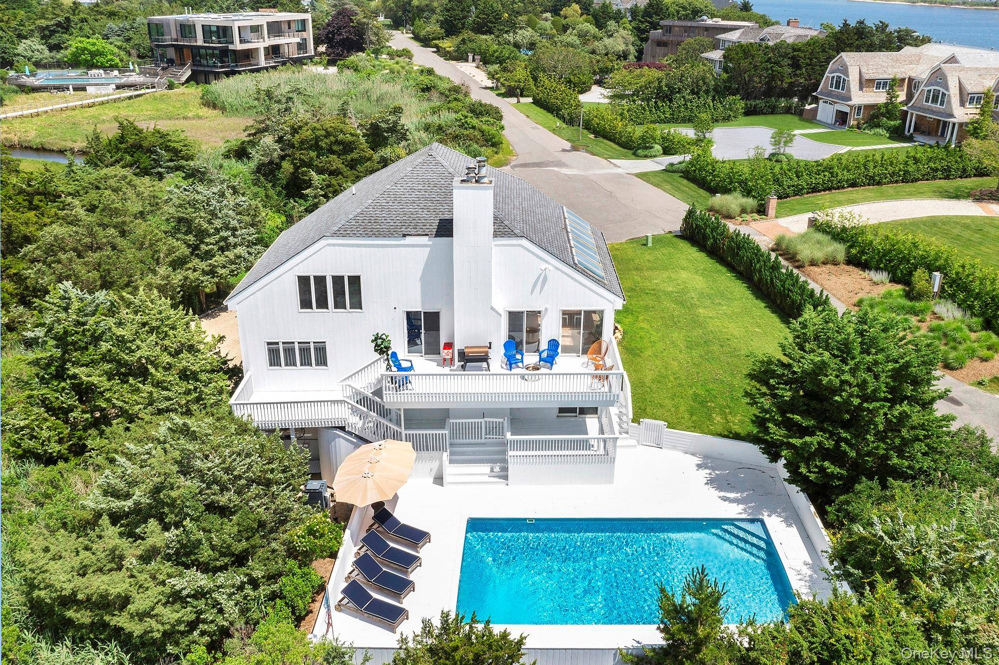 Enjoy near panoramic water views from this beautifully newly renovated 4 bedroom, 3 bath modern escape, tucked away on a quiet cul de sac just minutes walk to the heart ...