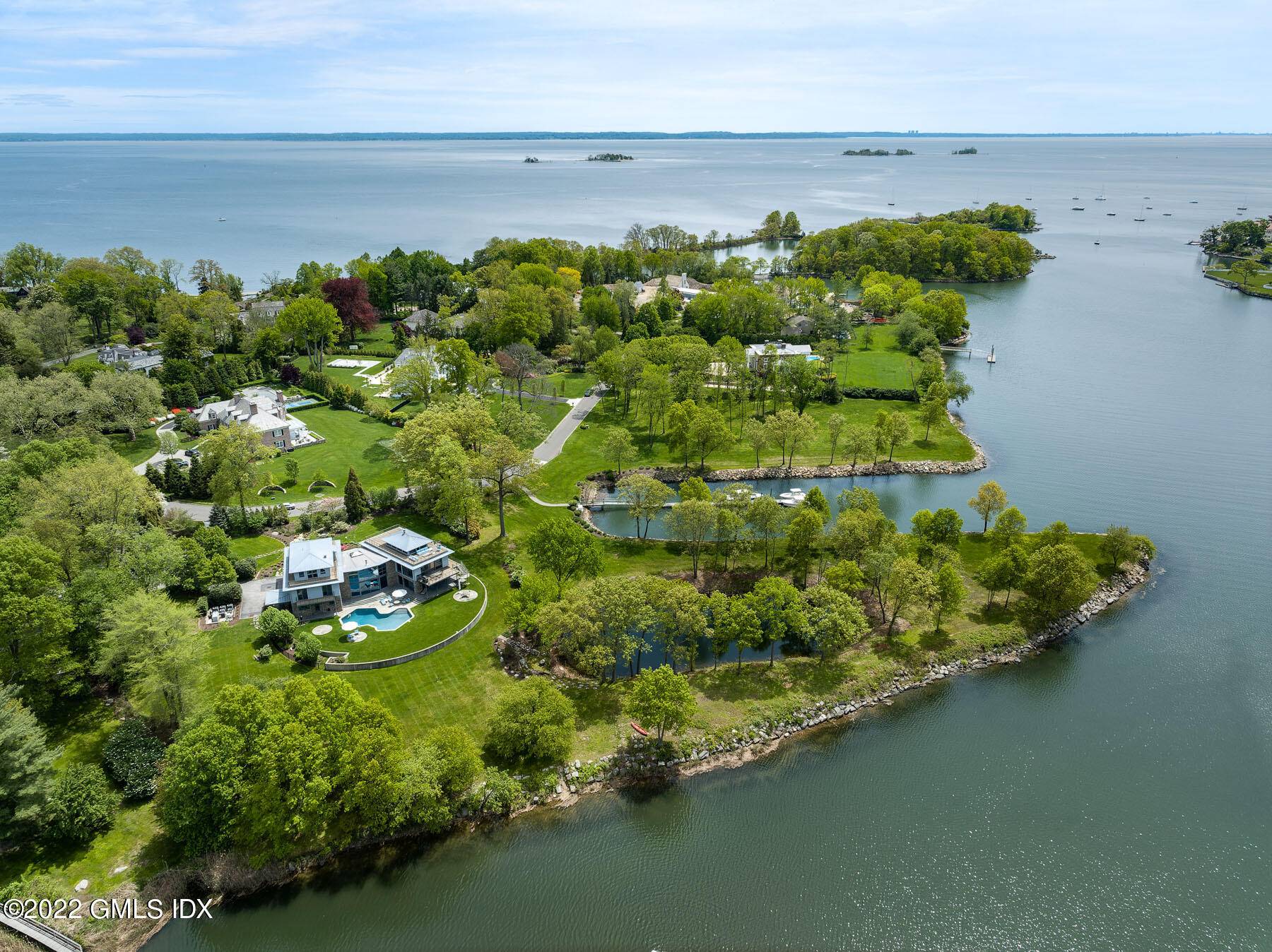 Stunning waterfront home in the exclusive, 24hr guard gated Mead Point association.