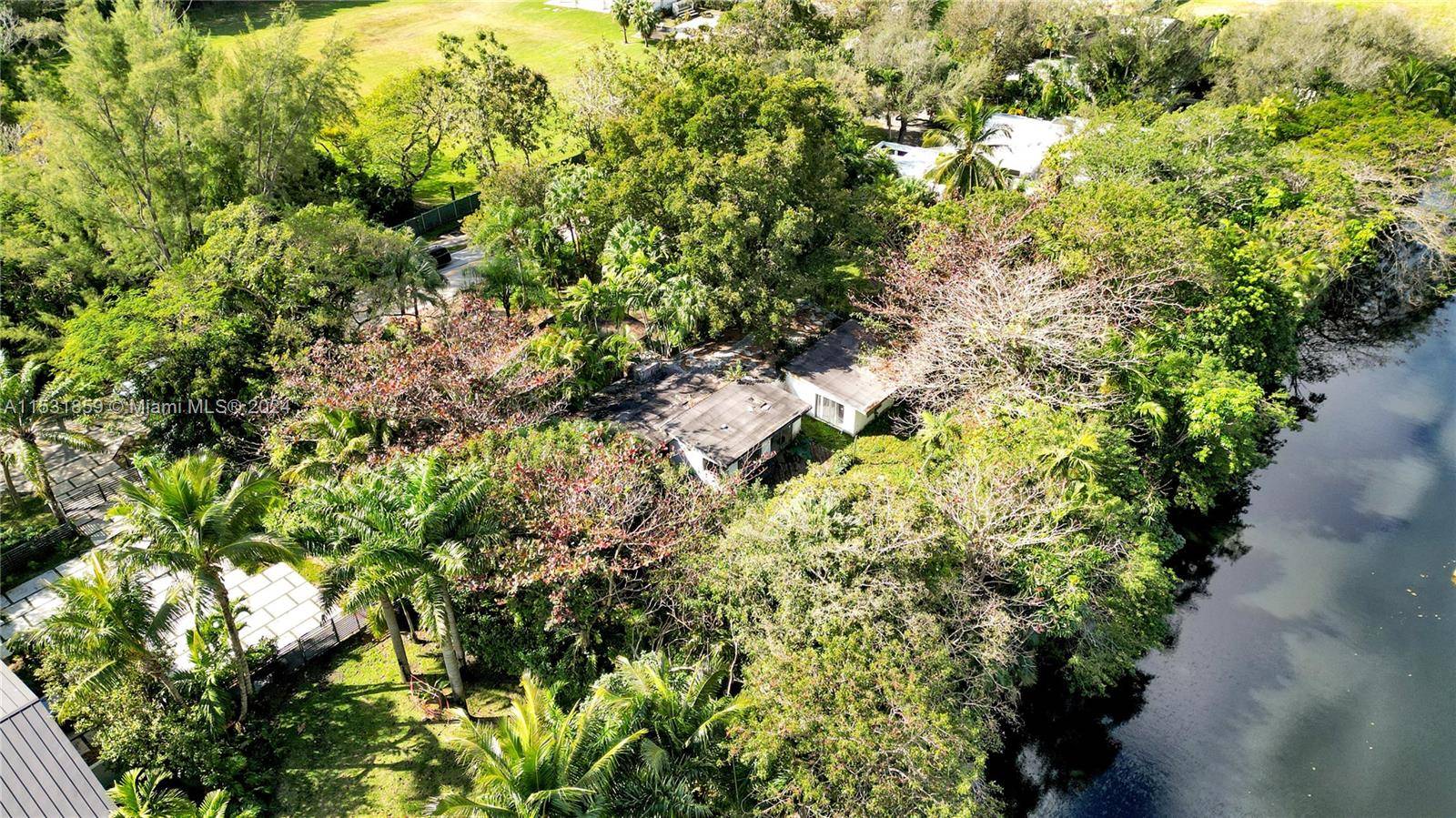Experience the epitome of lush private living at this North Pinecrest estate on a builder's acre of 29, 000 sf overlooking Snapper Creek Canal.
