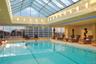 Indoor pool featuring a city view