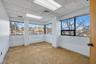 Carpeted spare room with a drop ceiling