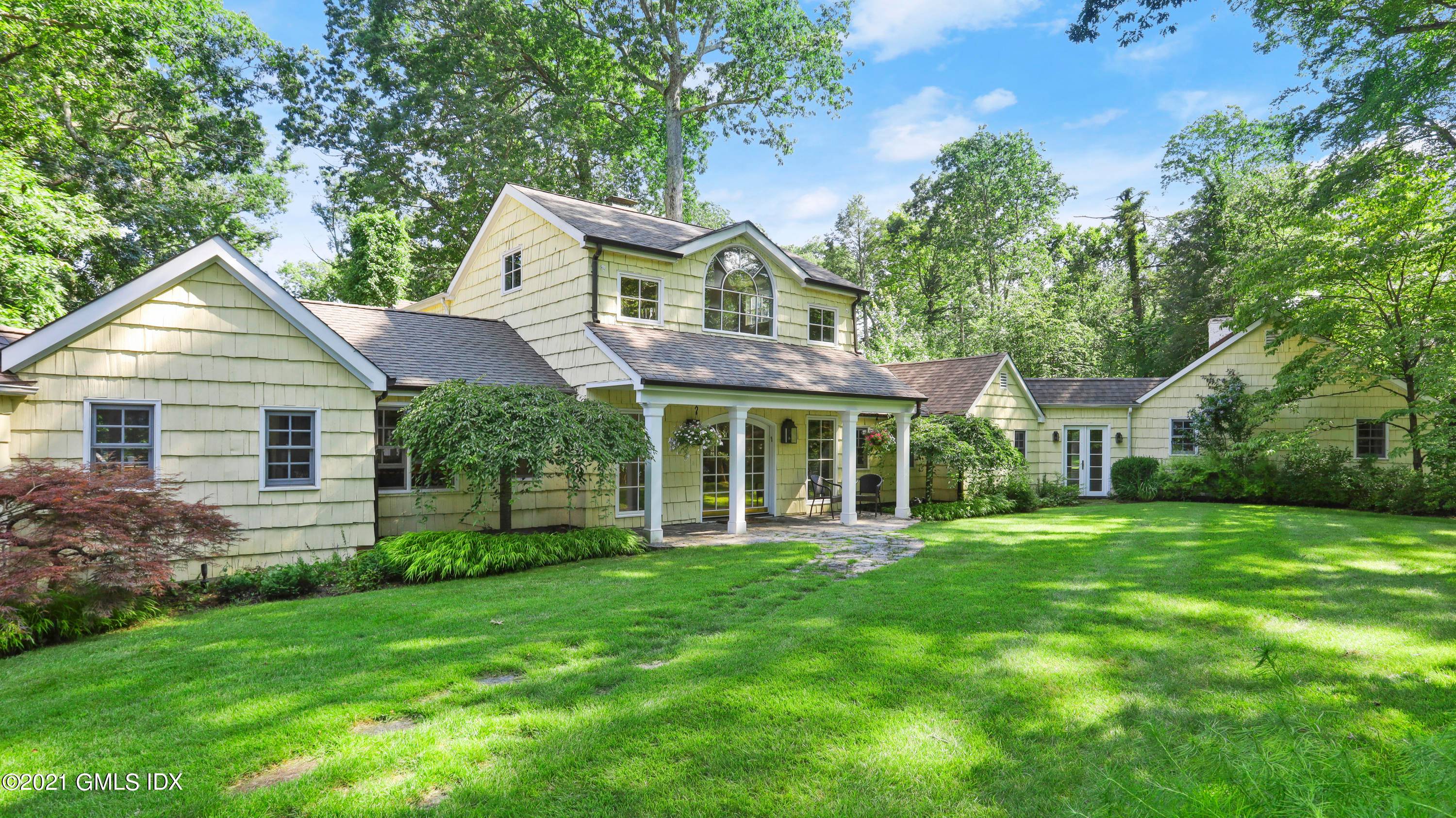 Nestled among rock outcroppings in a glen like setting with up lit, towering oaks and lush, open lawns at the end of a quiet backcountry lane is this ultimate multigenerational ...