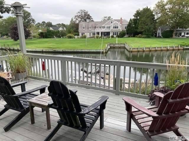 Comfortably warm, open concept home in a private neighborhood has views of Peconic Bay from the house and deck.