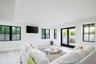 Living room with baseboards and light wood-style flooring