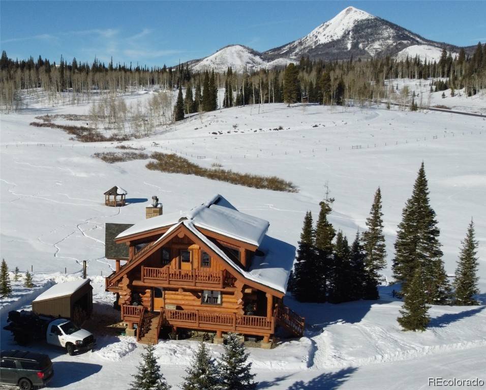Presenting an exceptional Colorado mountain retreat set on 5.