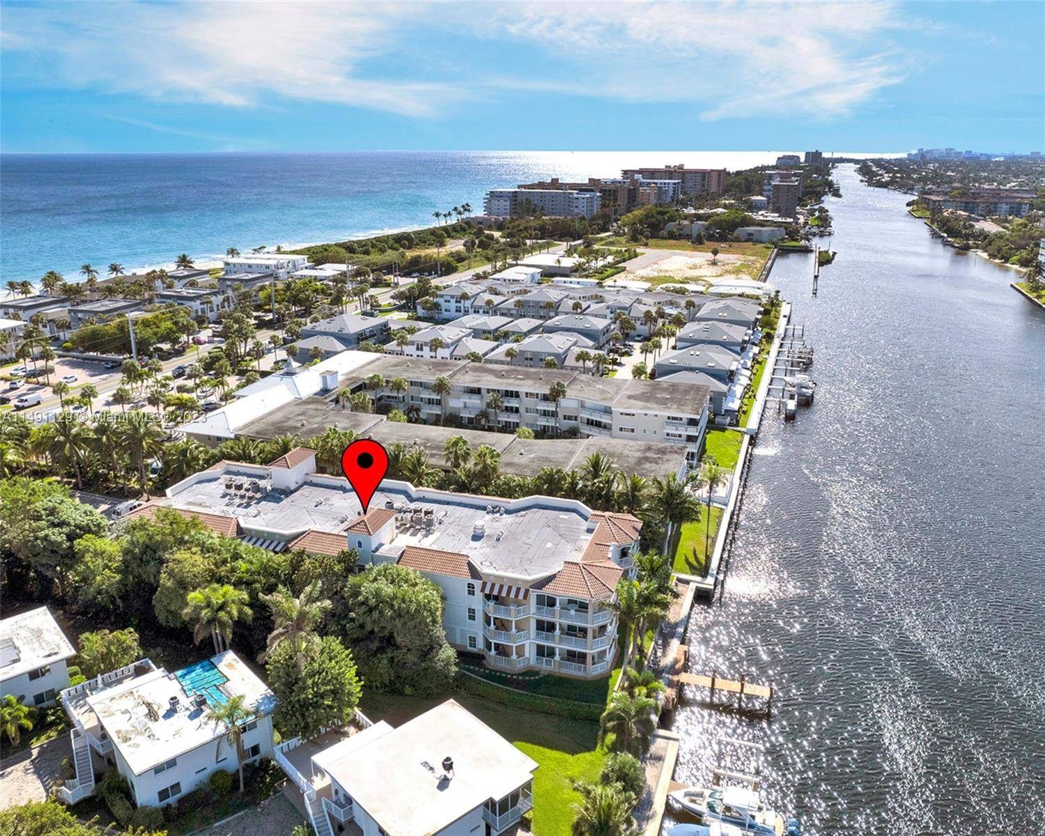 This Mediterranean style condo located on the INTRACOASTAL offers direct access to a PRIVATE BEACH across the street.