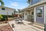 Another view of the expansive deck highlights the multiple seating areas and easy connection between the home and backyard.