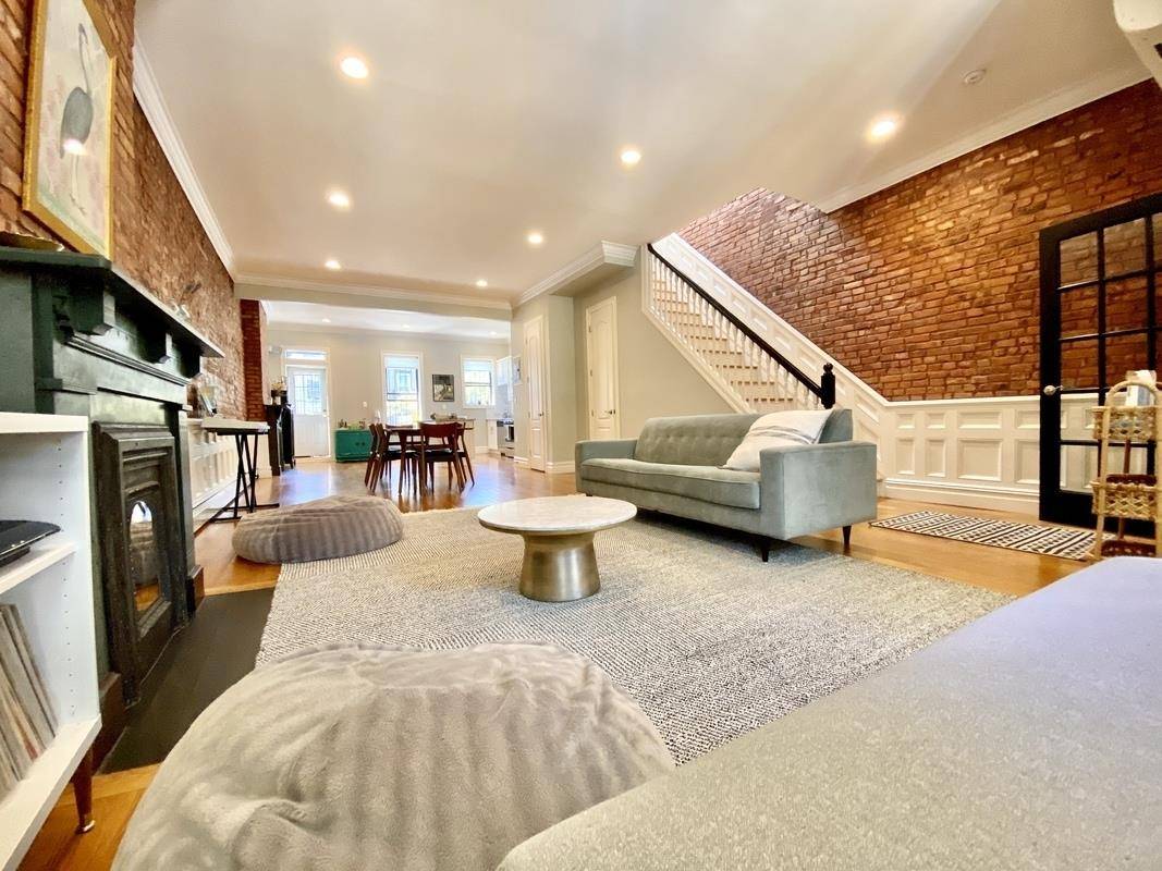 An astonishingly beautiful, two family Pre war Brick townhouse on a tree lined block of Bedford Stuyvesant.
