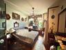Bedroom featuring wood finished floors and a chandelier