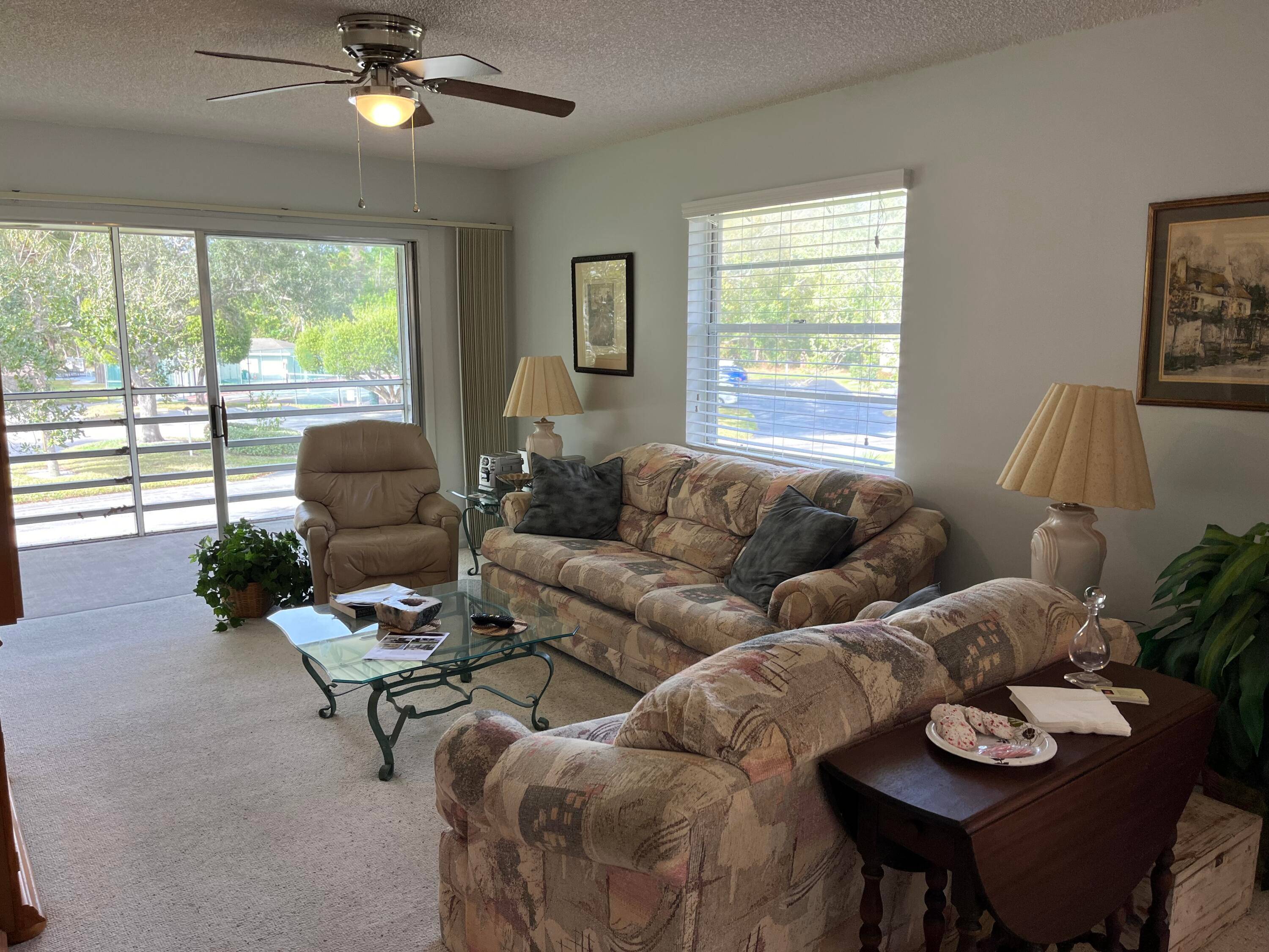 WHAT A VALUE ! Just steps from the clubhouse and pool, this 2 bed 2 bath, 2nd floor condo is fully furnished and ready for you !