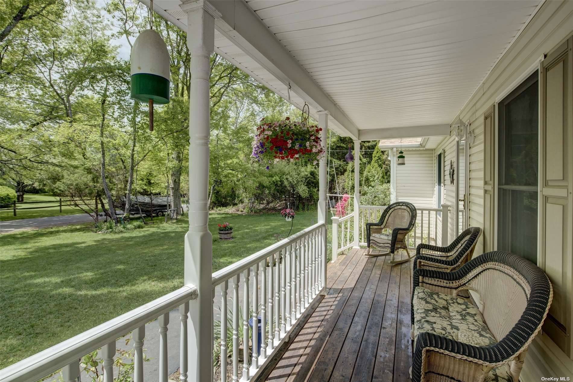 Summer in Orient. Relax on the front porch of this 3 bedroom, 2 bath Ranch in Green Acres, a short walk to association Sound beach amp ; Orient State Park.