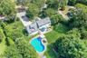 View of subject property with a pool
