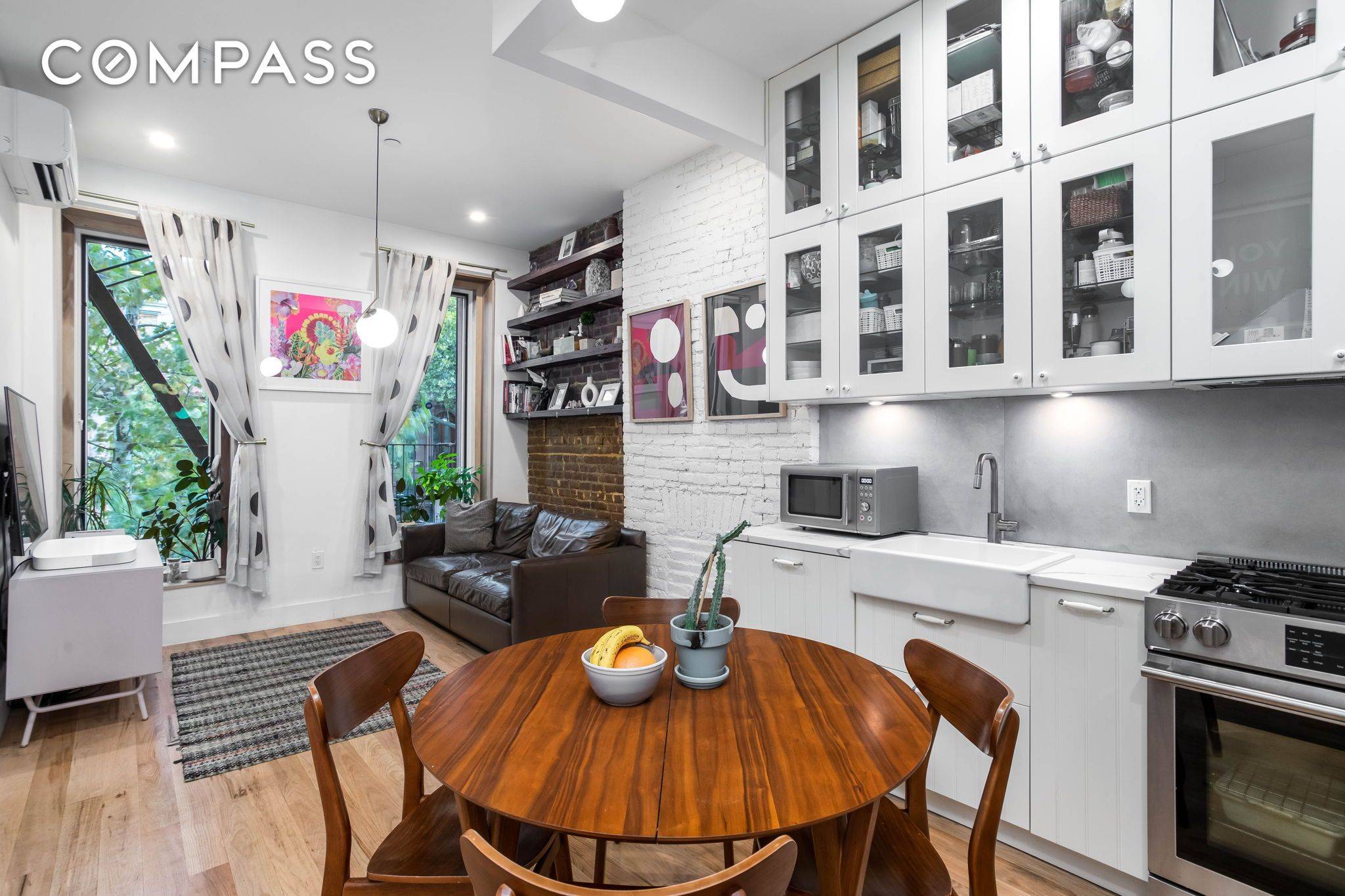 A sleek and sexy two bedroom parlor level townhouse condo in the heart of bustling Bedford Stuyvesant.