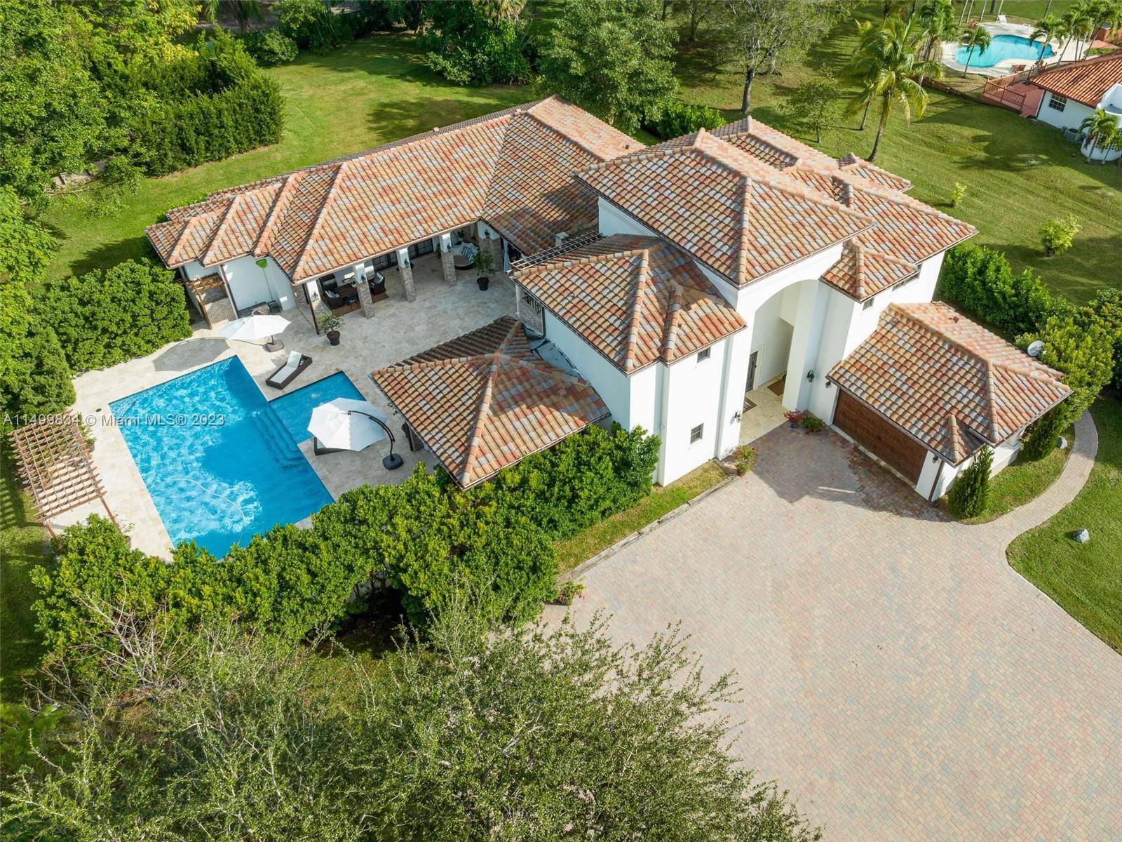Luxury awaits you at this exquisite custom built mediterranean estate situated on an extremely private, gated, 2.